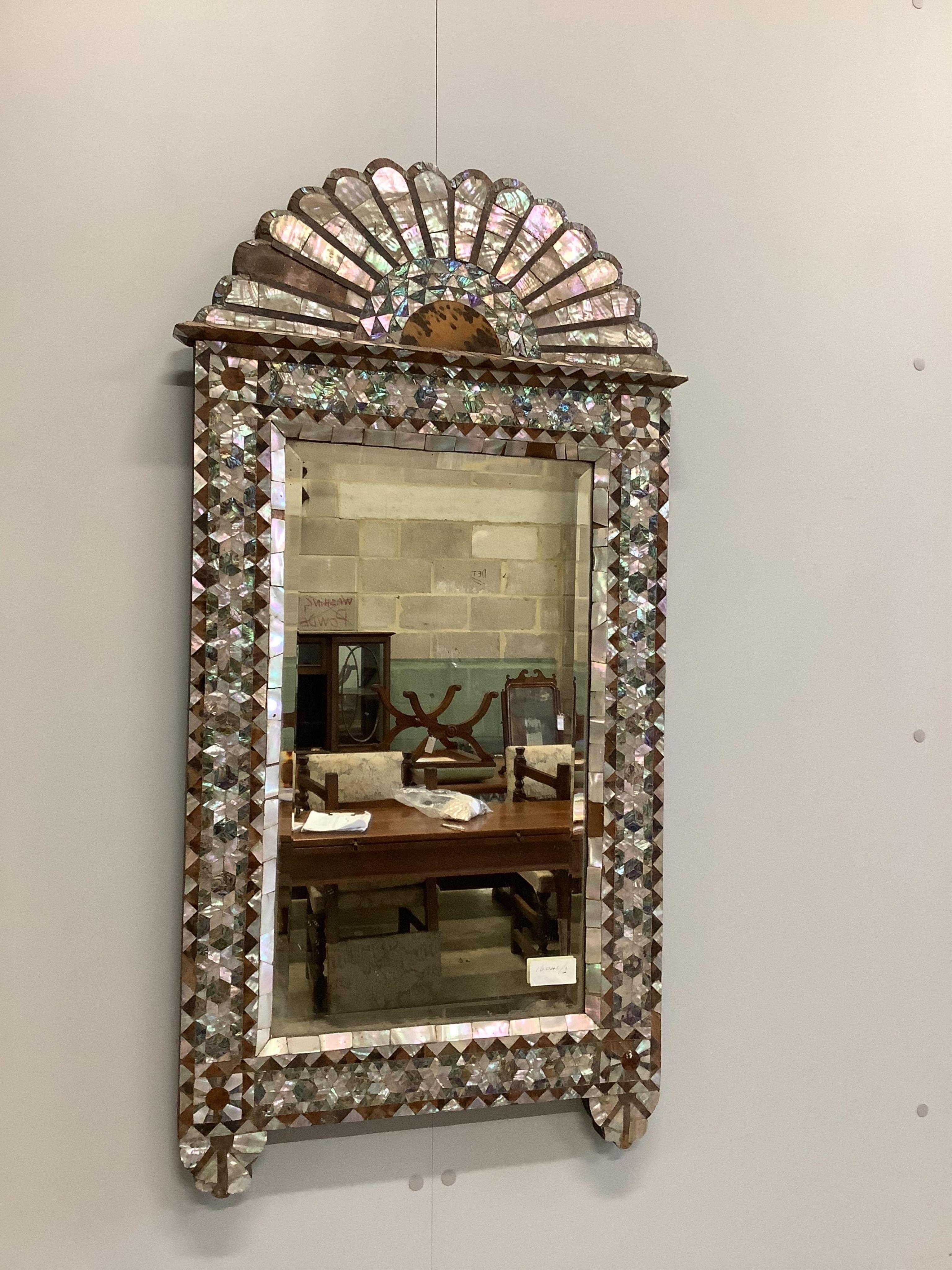 A 19th century Syrian mother-of-pearl and tortoiseshell inlay wall mirror, width 49cm, height 98cm. Condition - poor to fair